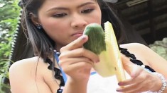 Long-legged cutie Sara uses a cucumber to play with her soft pink