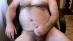 Hairy daddy bear stoking his cock